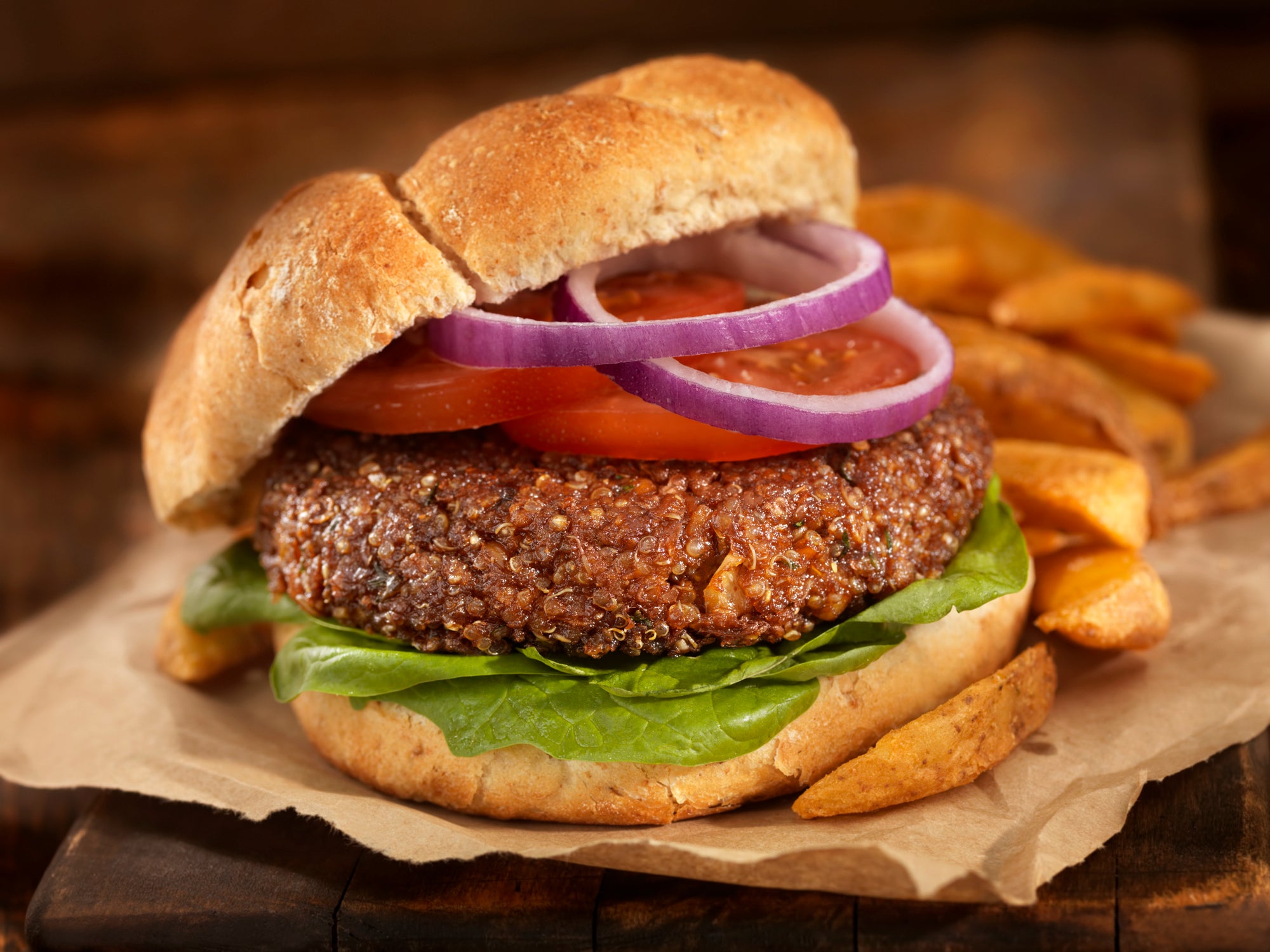 A vegetarian burger made from quinoa, chick peas, rolled outs, onions and garlic