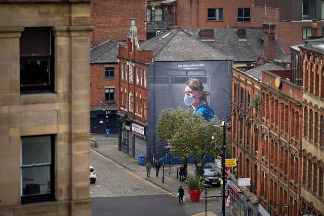 A mural depicting NHS nurse Melanie Senior in Manchester, where the strongest restrictions have been imposed
