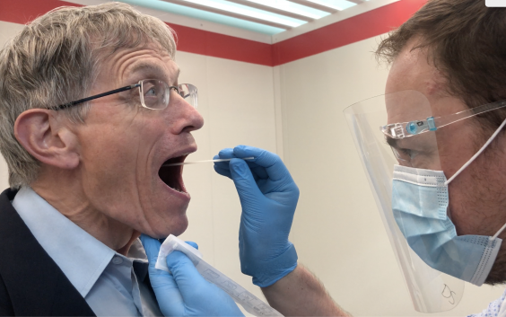 Open wide: Simon Calder receives a Lamp Covid test at Heathrow before travelling to Portugal on 17 May 2021