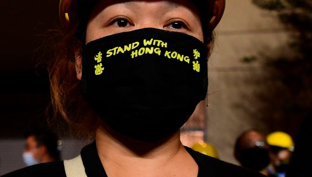An activist in front of the Chinese Consulate in Los Angeles, in October, in protest of the Chinese government’s treatment of Hong Kong