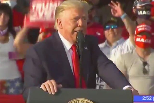 Trump supporter appears to use white power hand gesture during rally