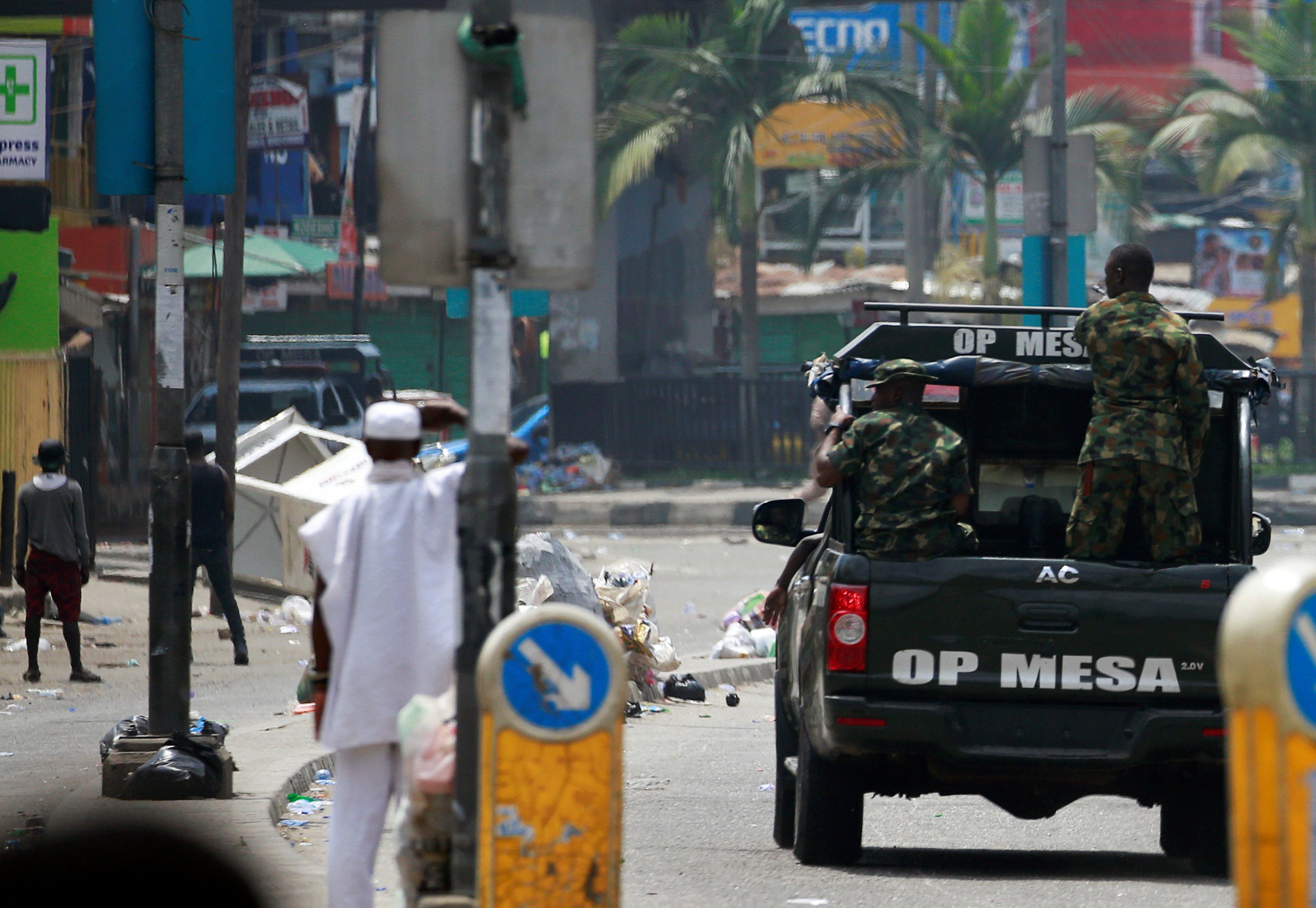 Military personnel drive along a street in Ikeja, in Lagos, Nigeria, on 23 October 2020