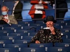 Trump supporter Kid Rock told to wear mask during Biden debate