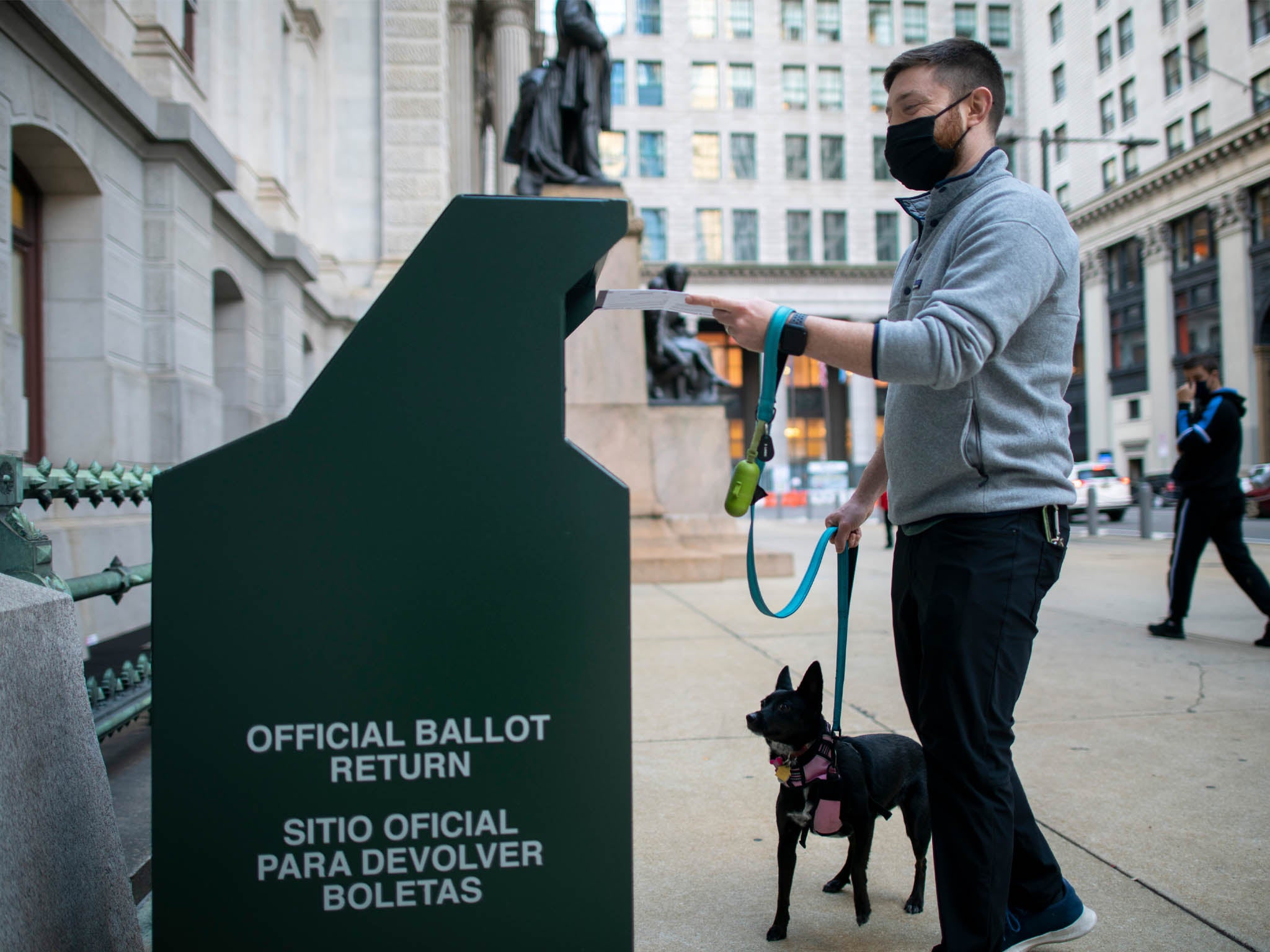 A voter casting his early voting ballot at drop box outside of City Hall on 17 October, 2020 in Philadelphia, Pennsylvania