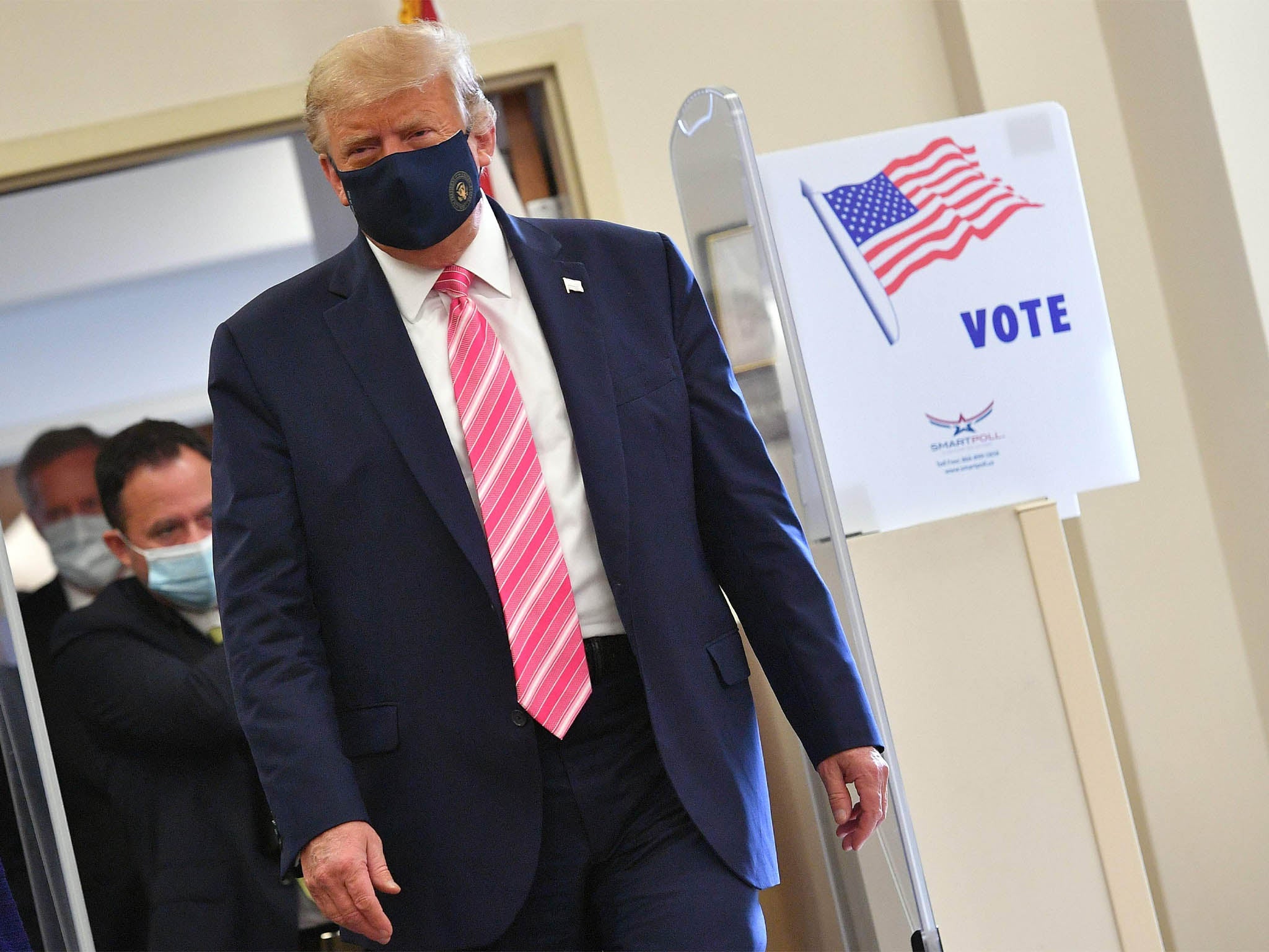 President Donald Trump leaves after casting his ballot at the Palm Beach County Public Library, during early voting for the 3 November election