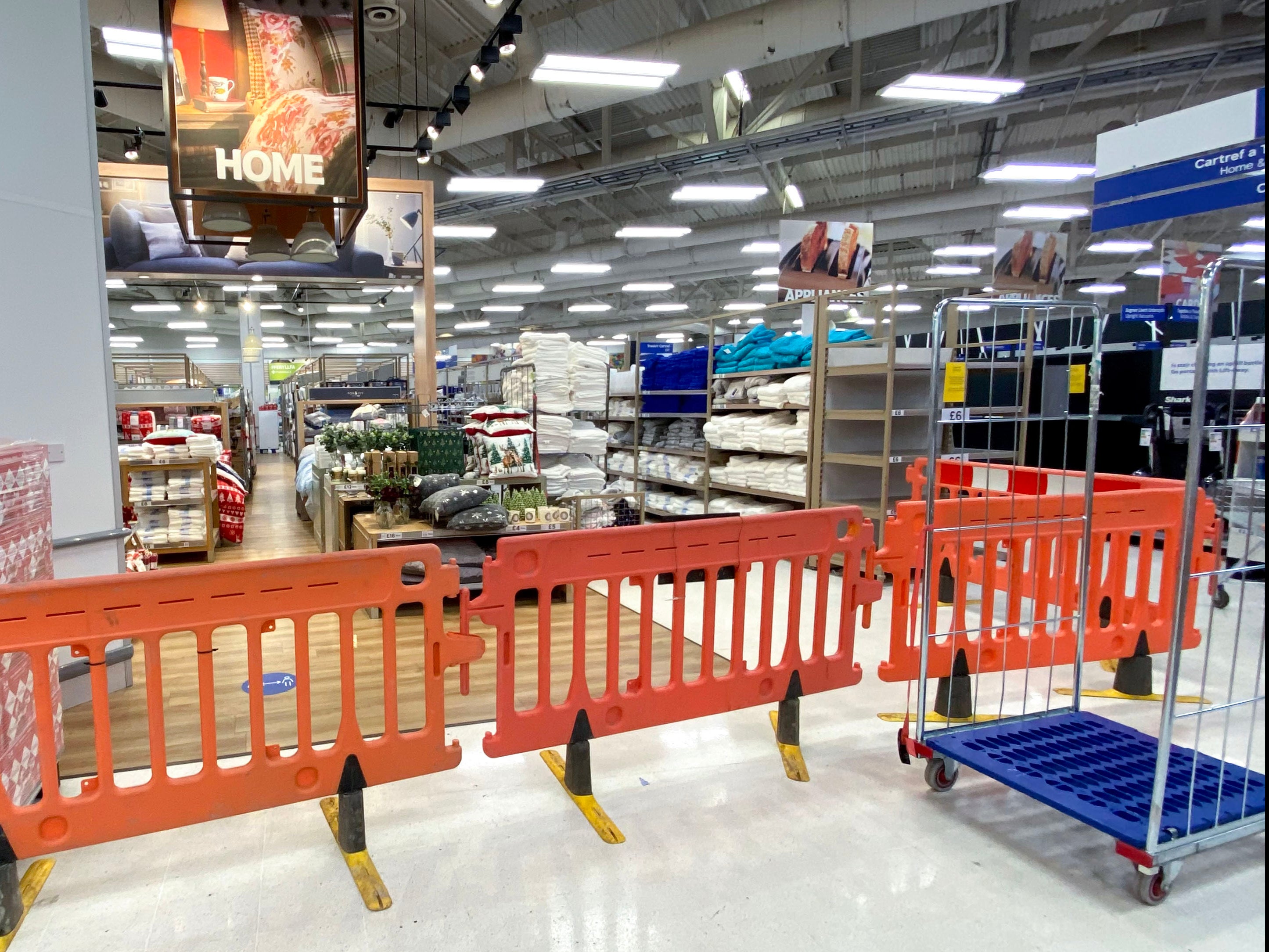 Non-essential items are blocked off in a Tesco supermarket on Western Avenue in Cardiff, Wales.