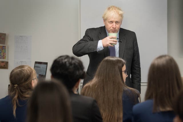 Prime Minister Boris Johnson meets pupils and takes part in a  media studies class during a visit to Ruislip High School in his constituency of Uxbridge, west London in September