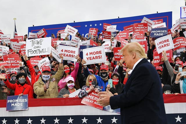 Supporters cheer as US President Donald Trump arrives to speak during a campaign rally at Pickaway Agriculture and Event Centre in Circleville, Ohio on 24 October, 2020