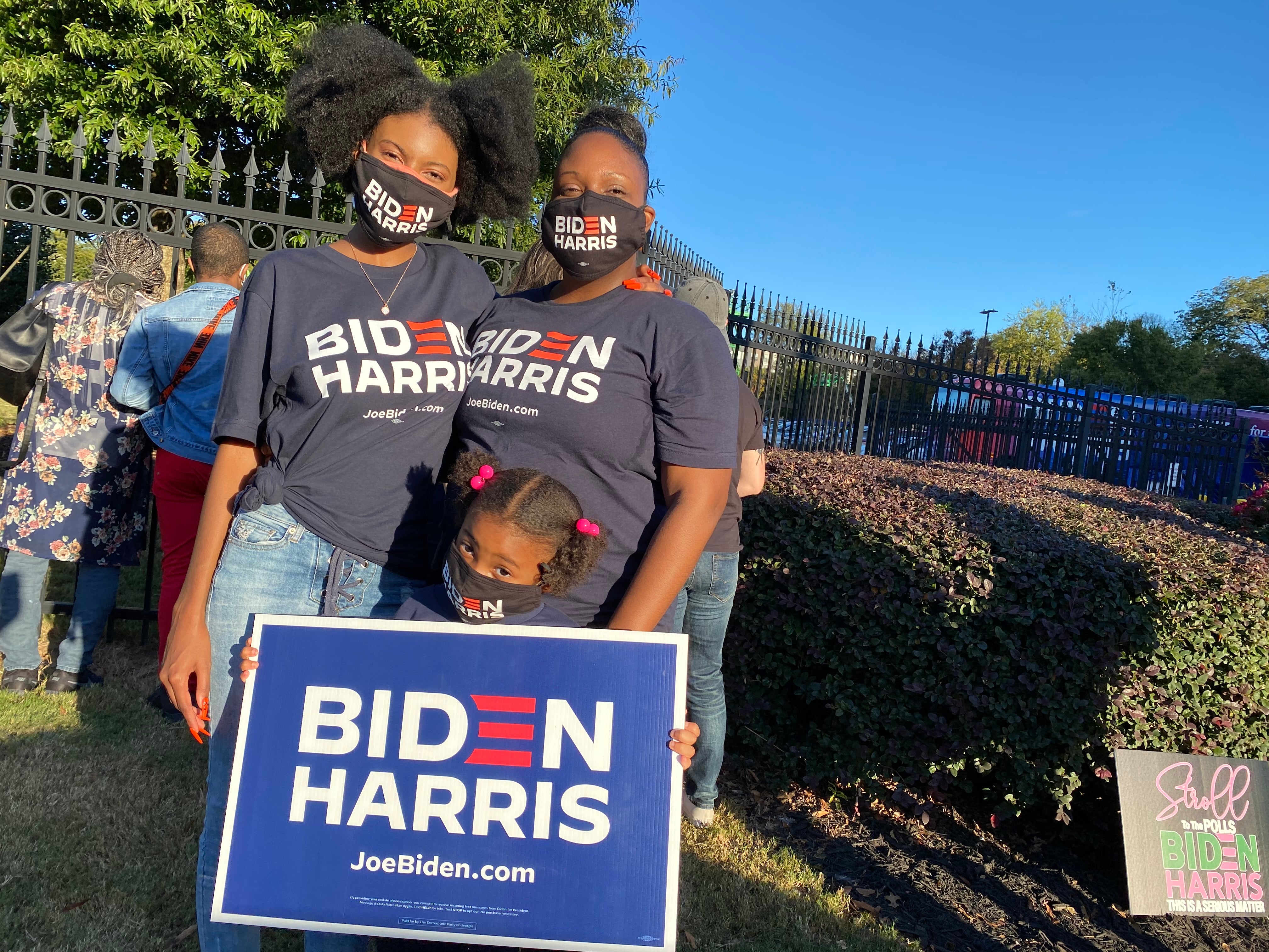 Yvonne Young and her two daughters outside of a Kamala Harris rally in Atlanta, Georgia