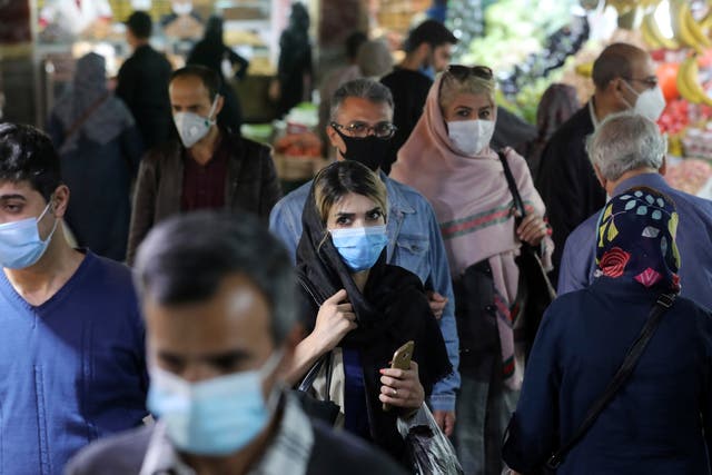 Virus Outbreak Iran Mixed Signals
