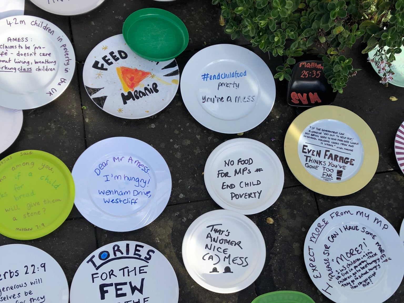 Handout photo issued by Sadie Hasler of empty plates outside a Conservative MP Sir David Amess Southend offices in protest over the party voting against plans to extend free school meals over holidays