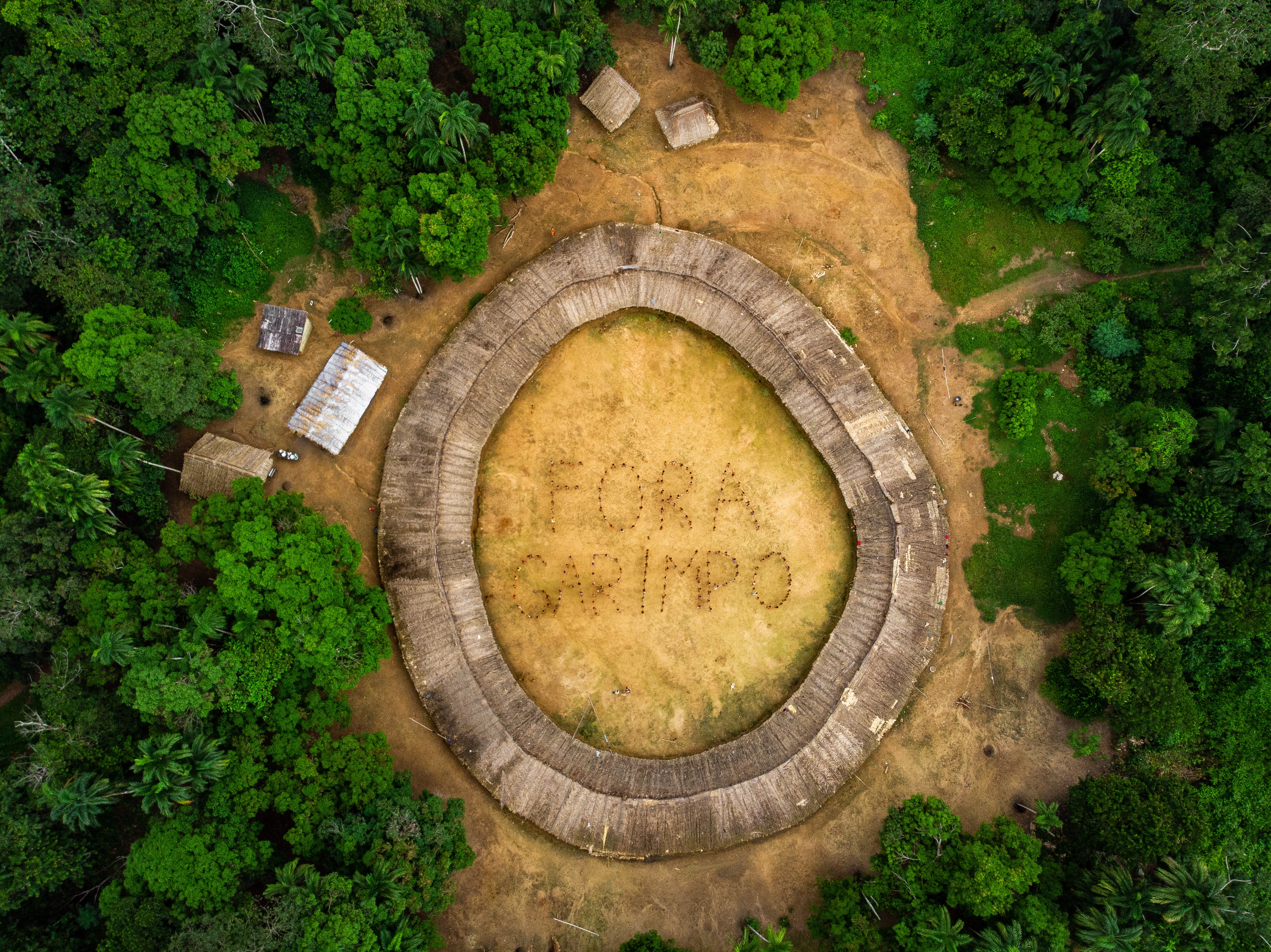 The 120 Yanomami and Yek’wana leaders at the meeting gather in the centre of the village, and holding hands, spell out the message they want to send to Brazil and the world: no more mining!