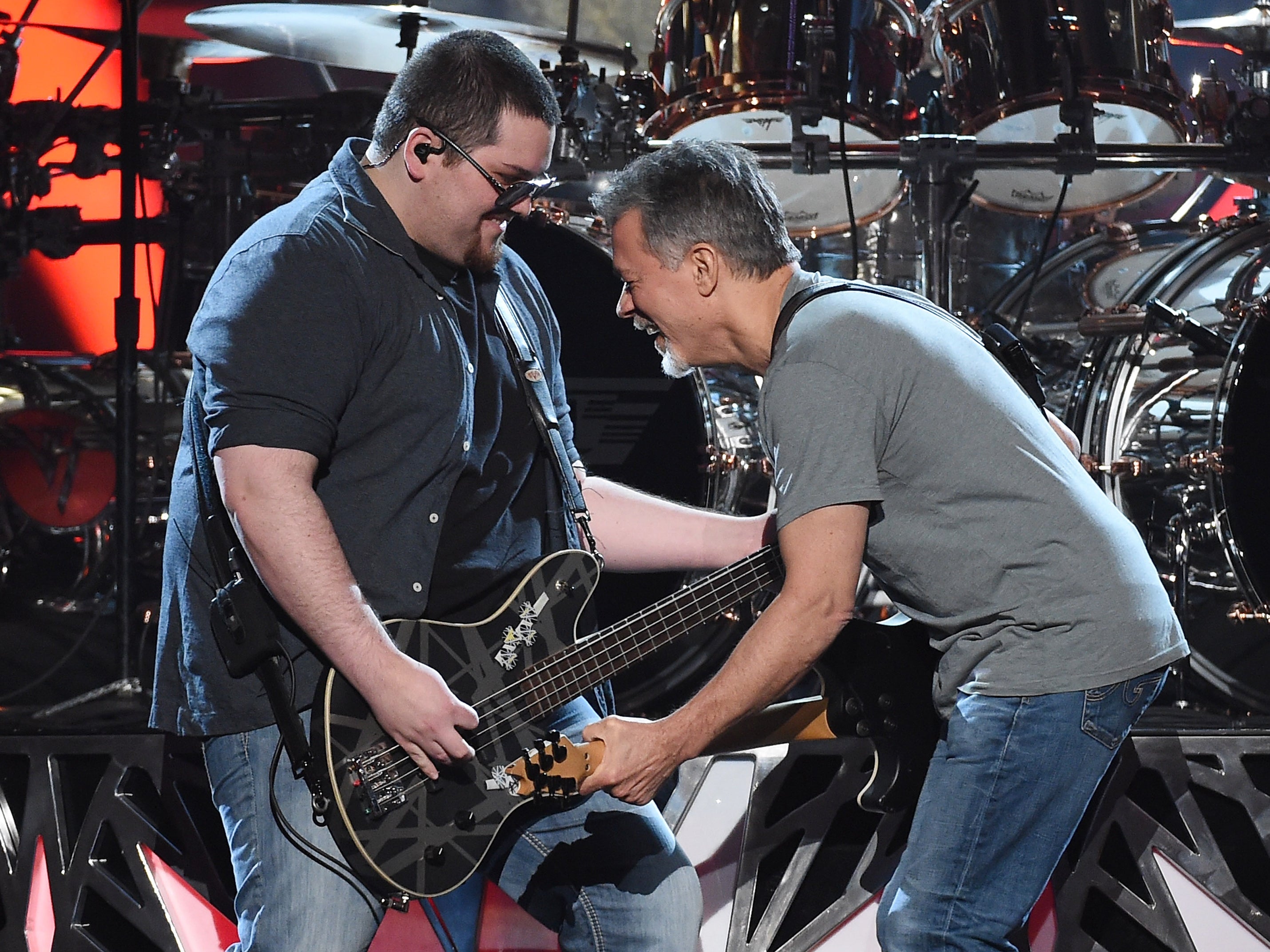 Bassist Wolfgang Van Halen (L) and guitarist Eddie Van Halen of Van Halen perform during the 2015 Billboard Music Awards