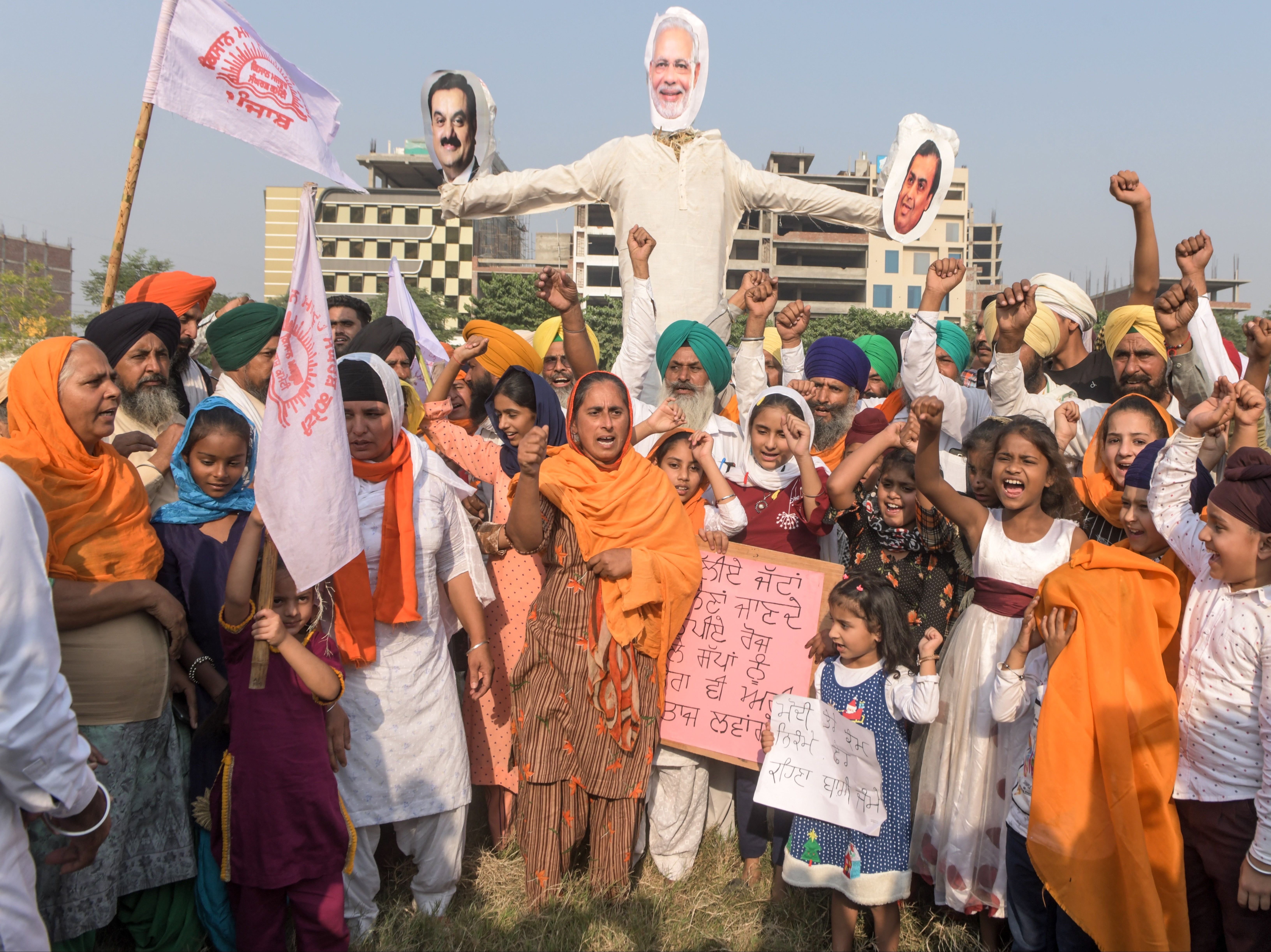 Punjab’s farmers burn an effigy of prime minister Narendra Modi as part of protests against new agricultural reforms