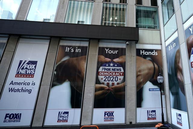 <p>A political display is posted on the outside of the Fox News headquarters on 6th Avenue in New York on 21 July 2020</p>