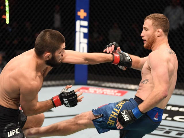 <p>Khabib Nurmagomedov (left) retired in 2020 after submitting Justin Gaethje</p>