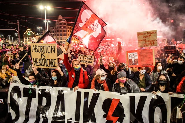 <p>People protest against the ruling by Poland’s constitutional tribunal that imposes a near-total ban on abortion</p>