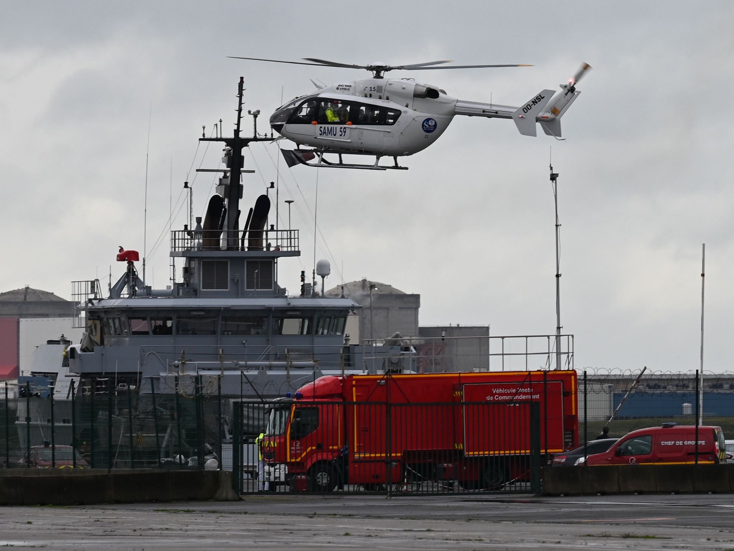 A SAMU (French Urgent Medical Aid Service) helicopter landing at Dunkerque port, northern France amid a rescue operation after a migrant boat sank on 27 October 