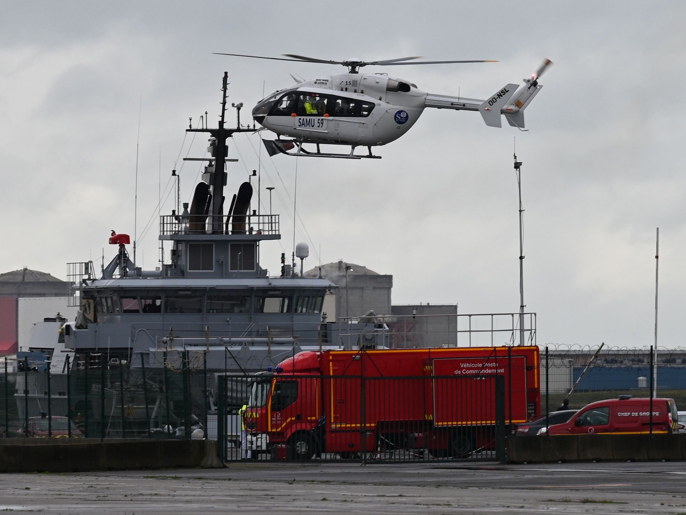 A SAMU (French Urgent Medical Aid Service) helicopter landing at Dunkerque port, northern France amid a rescue operation after a migrant boat sank on 27 October