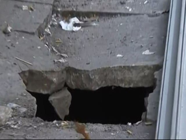 The hole in the Bronx pavement that Leonard Shoulders fell down on Saturday 24 October 2020