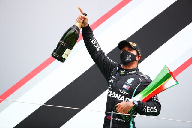 Lewis Hamilton celebrates winning the Portuguese Grand Prix to break Michael Schumacher’s record of 91 wins