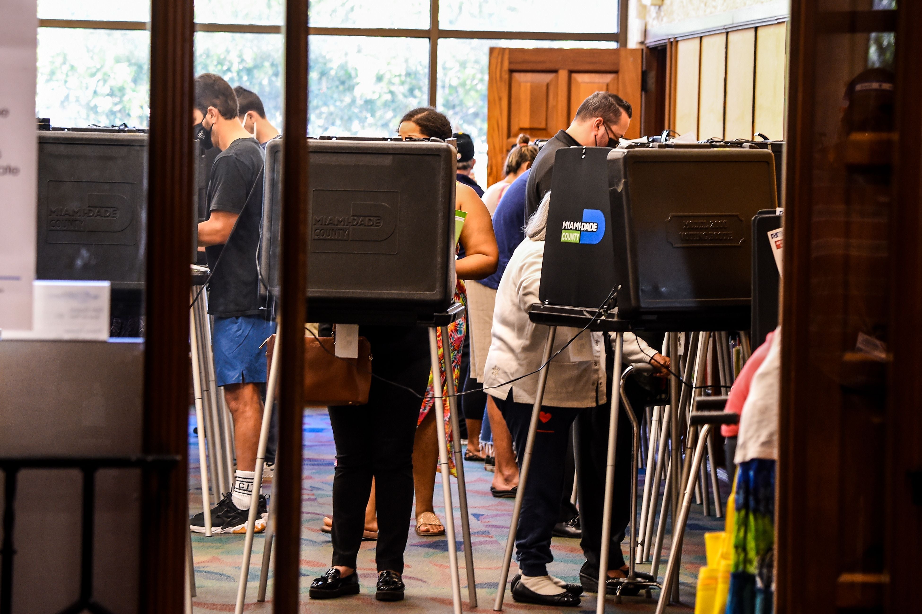 Voters cast their early ballots at the Coral Gables Branch Library in Miami