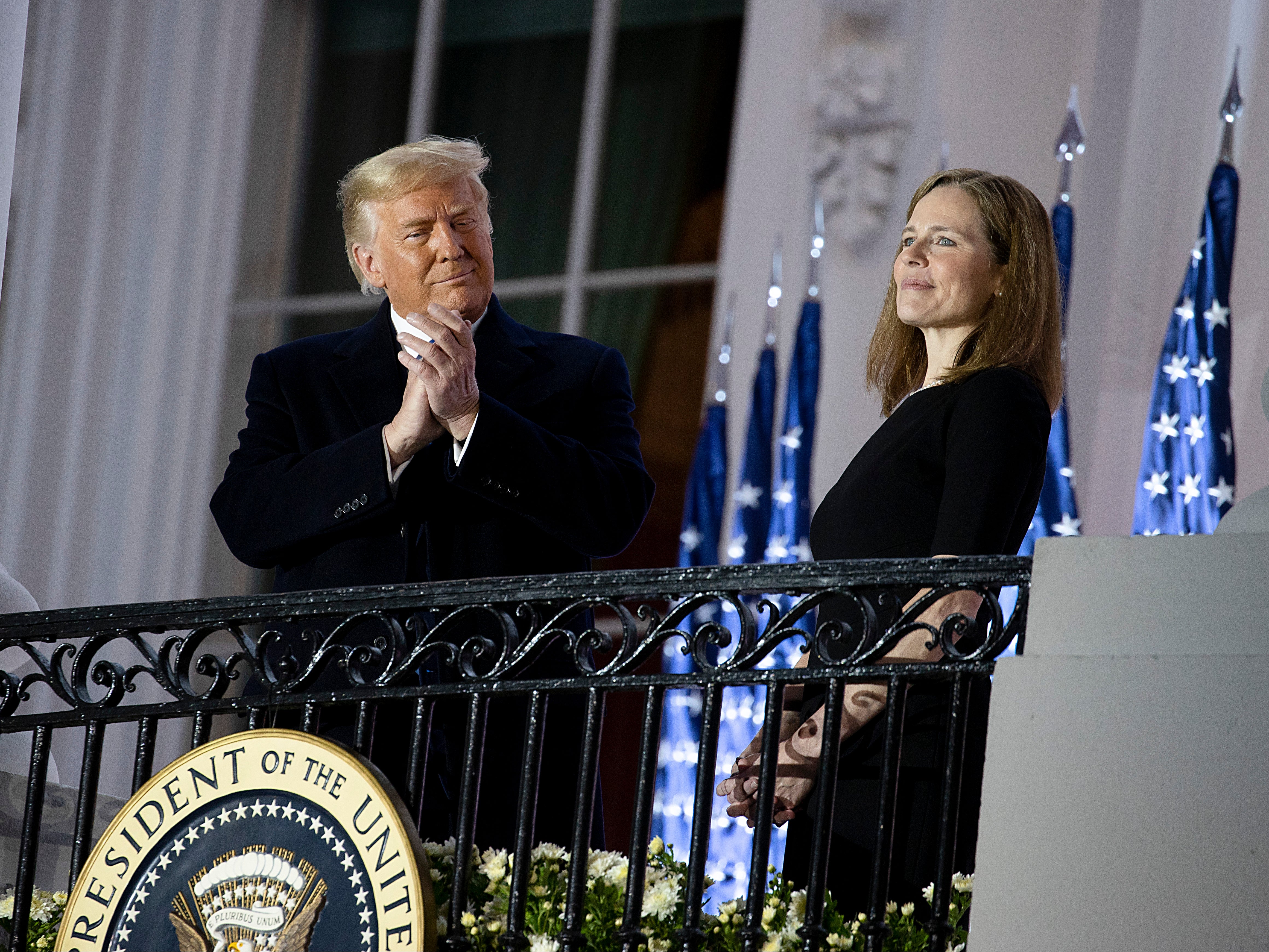 Donald Trump and the newly sworn-in Supreme Court Associate Justice Amy Coney Barrett