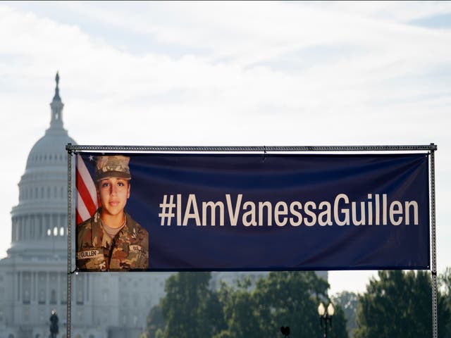 A banner with the image of slain Army Secialist Vanessa Guillen and #IAmVanessaGuillen is displayed before the start of a news conference on the National Mall in Washington, DC on 30 July