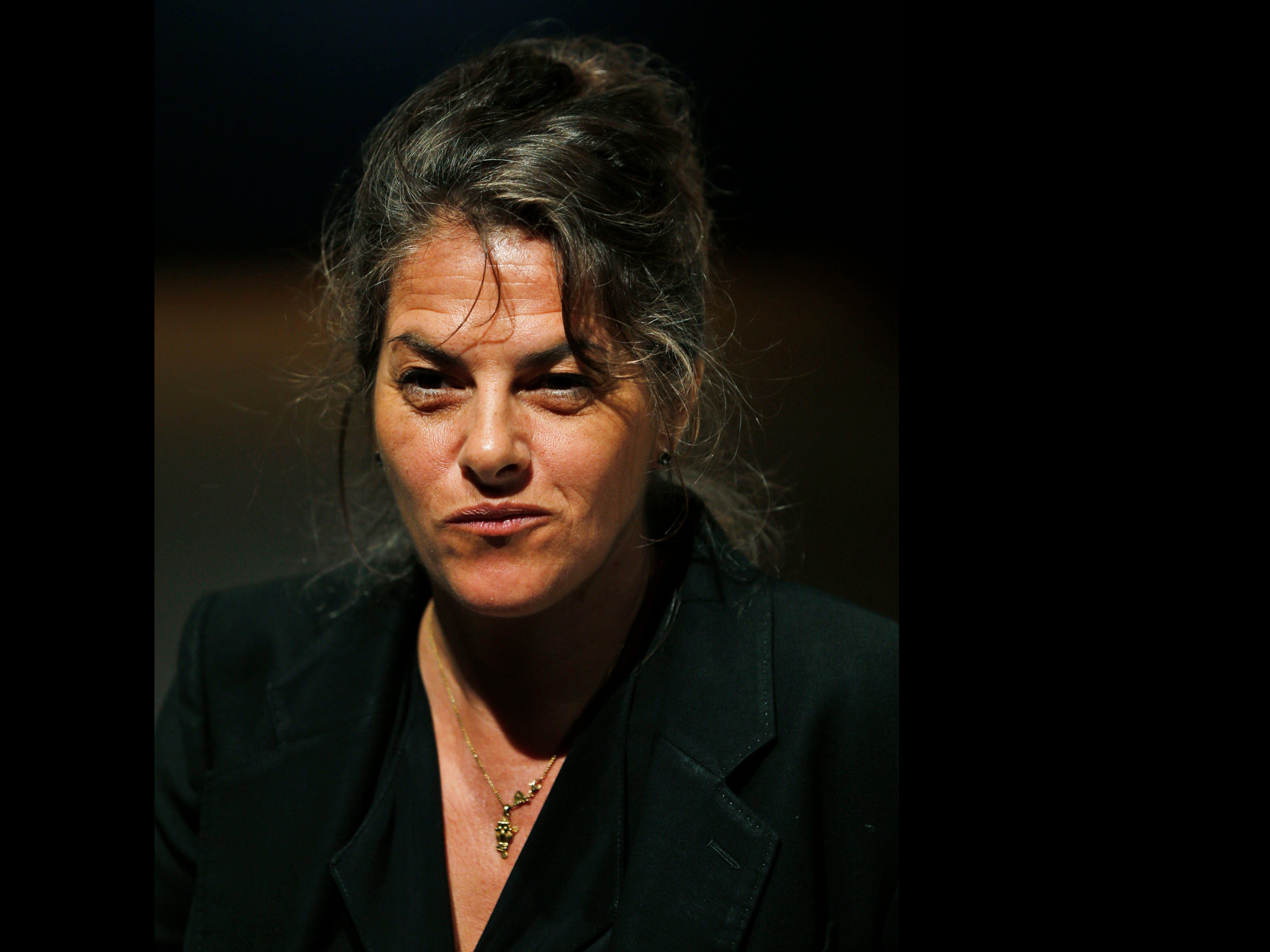 Tracey Emin on 27 June 2014 at an auction house exhibition next to her 1998 piece ‘My Bed'