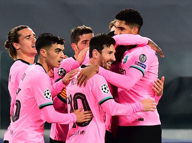 Lionel Messi and the rest of his Barca teammates swamp Ousmane Dembele