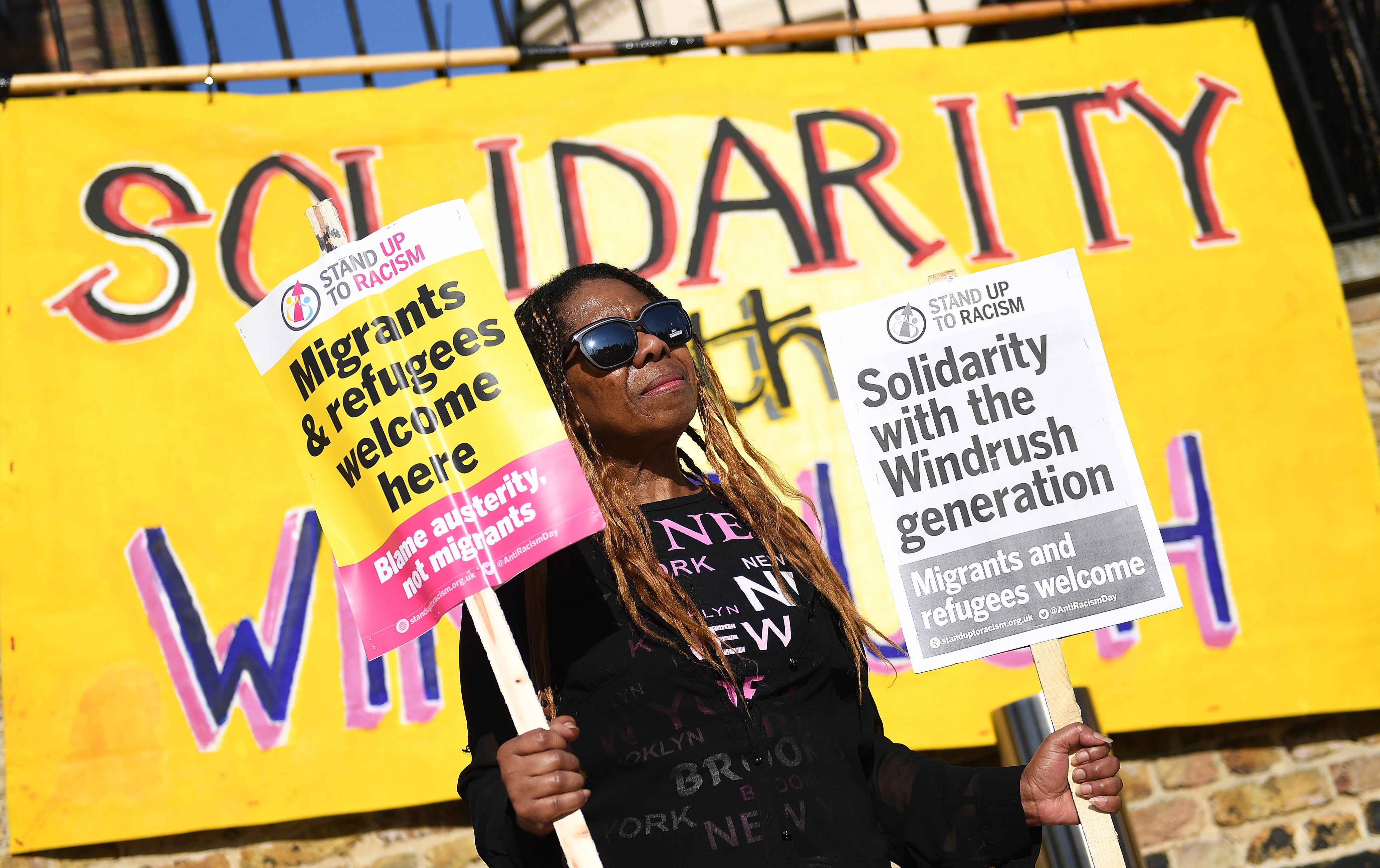 A woman gathers for a Windrush generation solidarity protest in Brixton, 20 April, 2018