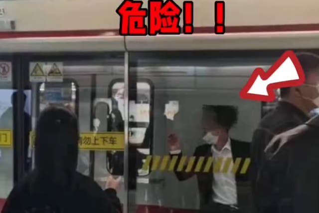 Man gets stuck between train and screen