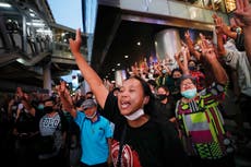 Thailand protesters take to street to mock fashion show 