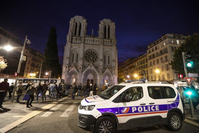 <p>Police outside the Basilica of Notre-Dame in Nice, where a knife-wielding man killed three people on 29 October 2020</p>