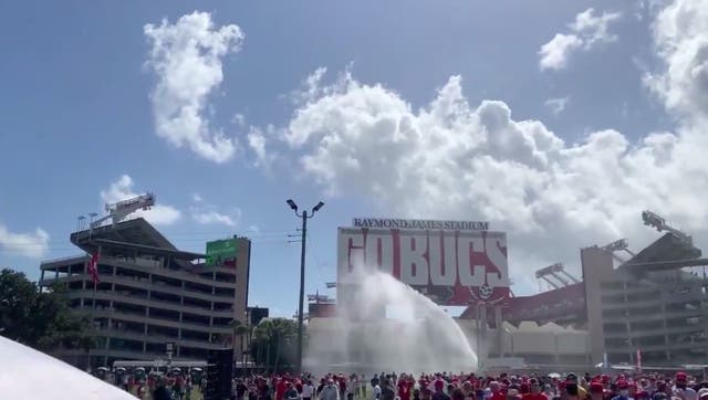 <p>Truck sprays water on the crowd as supporters wait in heat during Trump’s Tampa rally</p>