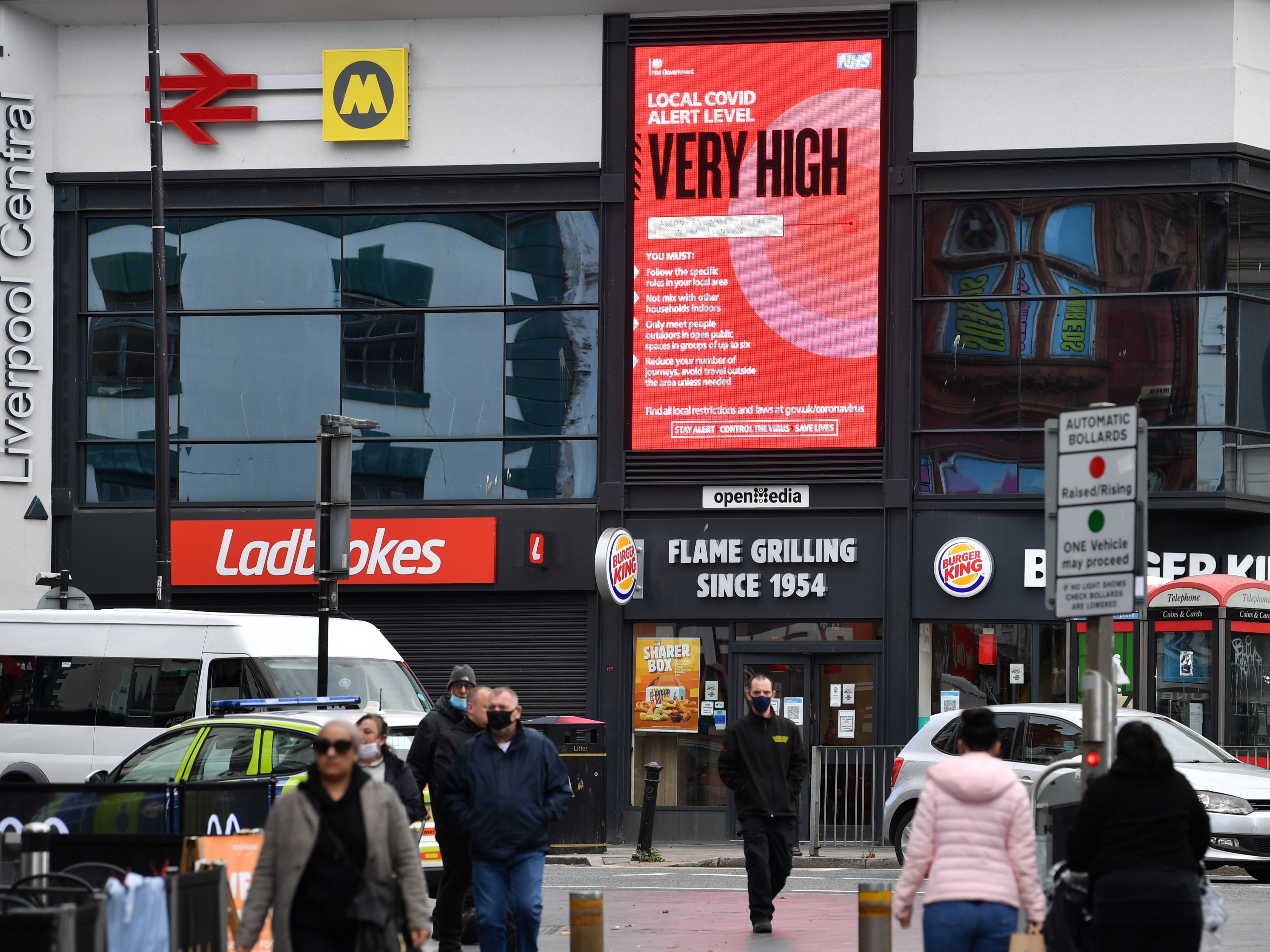 A coronavirus NHS billboard warns pedestrians at Liverpool central station in Liverpool