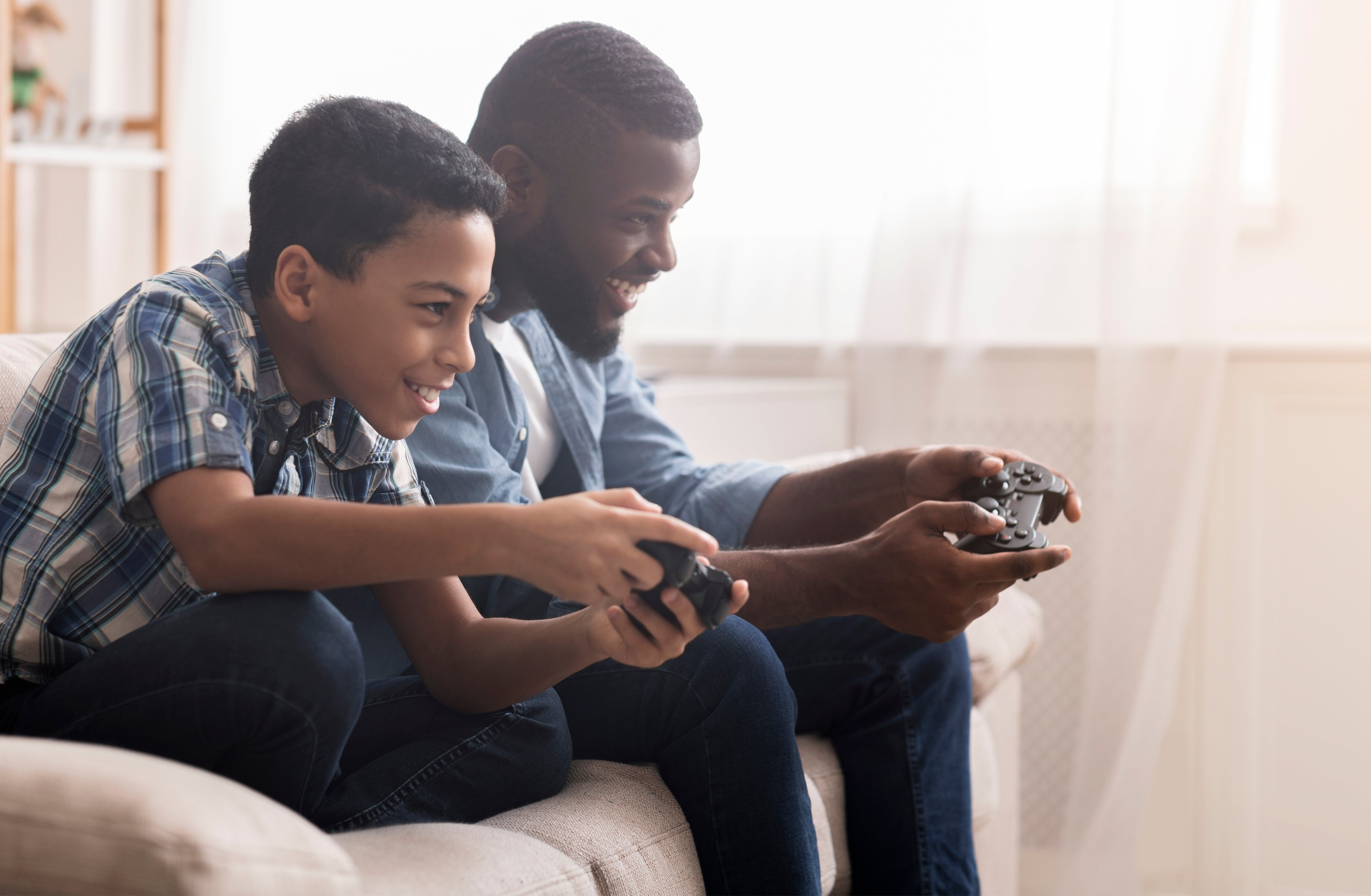 Parents playing five extra hours of video games a week to bond with their  children, poll finds