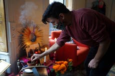 For many Latinos, virus deaths loom over Day of the Dead