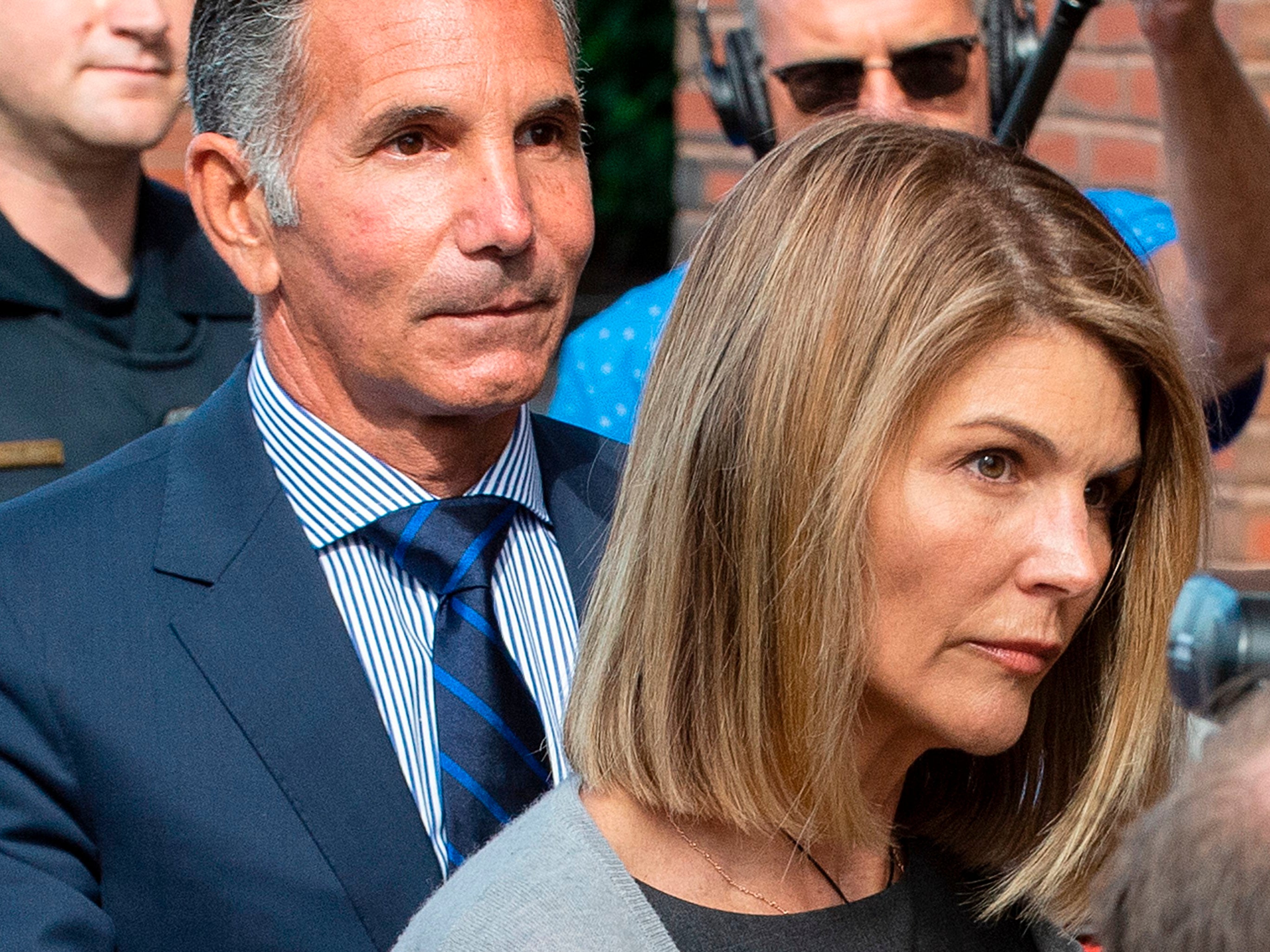 Lori Loughlin and husband Mossimo Giannulli exit the Boston federal courthouse on 27 August 2019