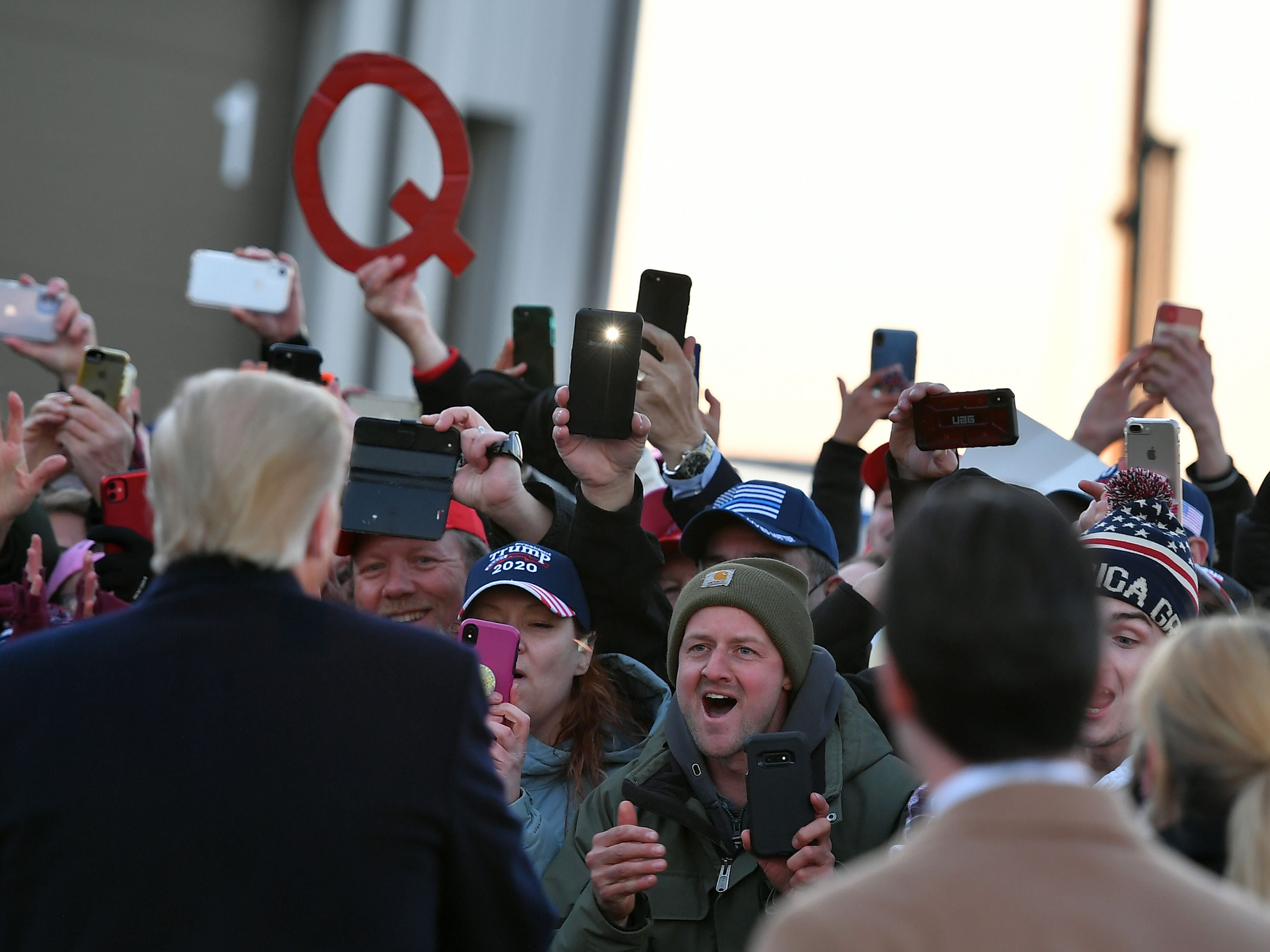 US President Donald Trump greets supporters at the overflow location ahead of a campaign rally at Rochester International Airport in Rochester, Minnesota on October 30, 2020. (Photo by MANDEL NGAN / AFP) (Photo by MANDEL NGAN/AFP via Getty Images)