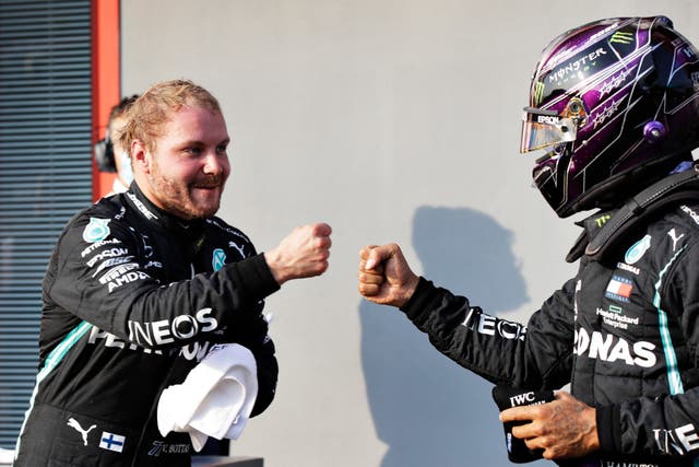 <p>Valtteri Bottas is congratulated by Lewis Hamilton</p>