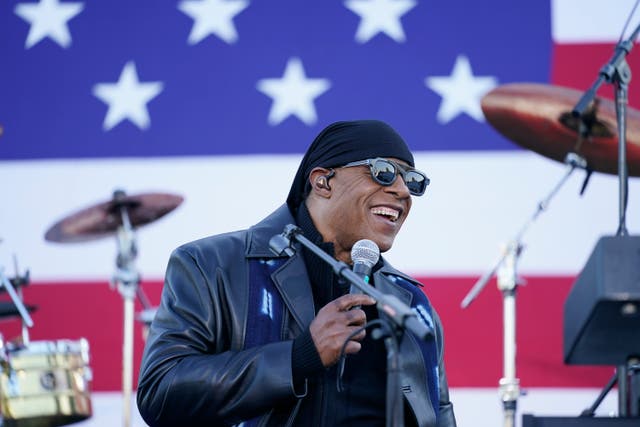 Stevie Wonder speaks before he performs and before Democratic presidential candidate former Vice President Joe Biden and former President Barack Obama speak at a rally at Belle Isle Casino in Detroit, Mich., Saturday, Oct. 31, 2020. (AP Photo/Andrew Harnik)