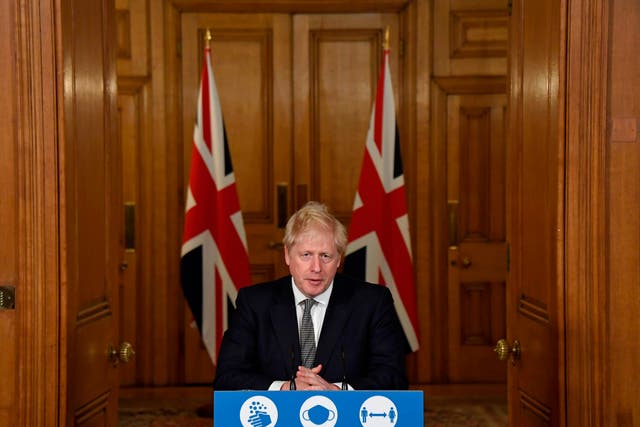Boris Johnson speaks during a virtual press conference inside 10 Downing Street