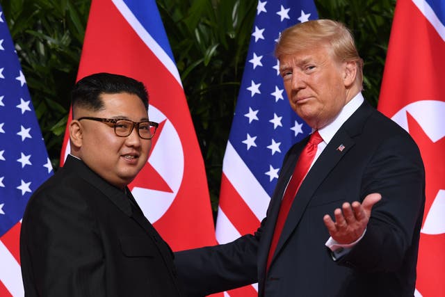 <p>The US president meets with his North Korean counterpart at their summit in Singapore in June 2018</p>