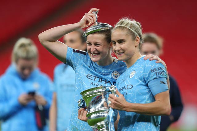 Ellen White and Steph Houghton celebrate with the trophy
