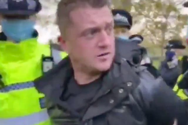 Tommy Robinson is led away by police after attending London’s Hyde Park