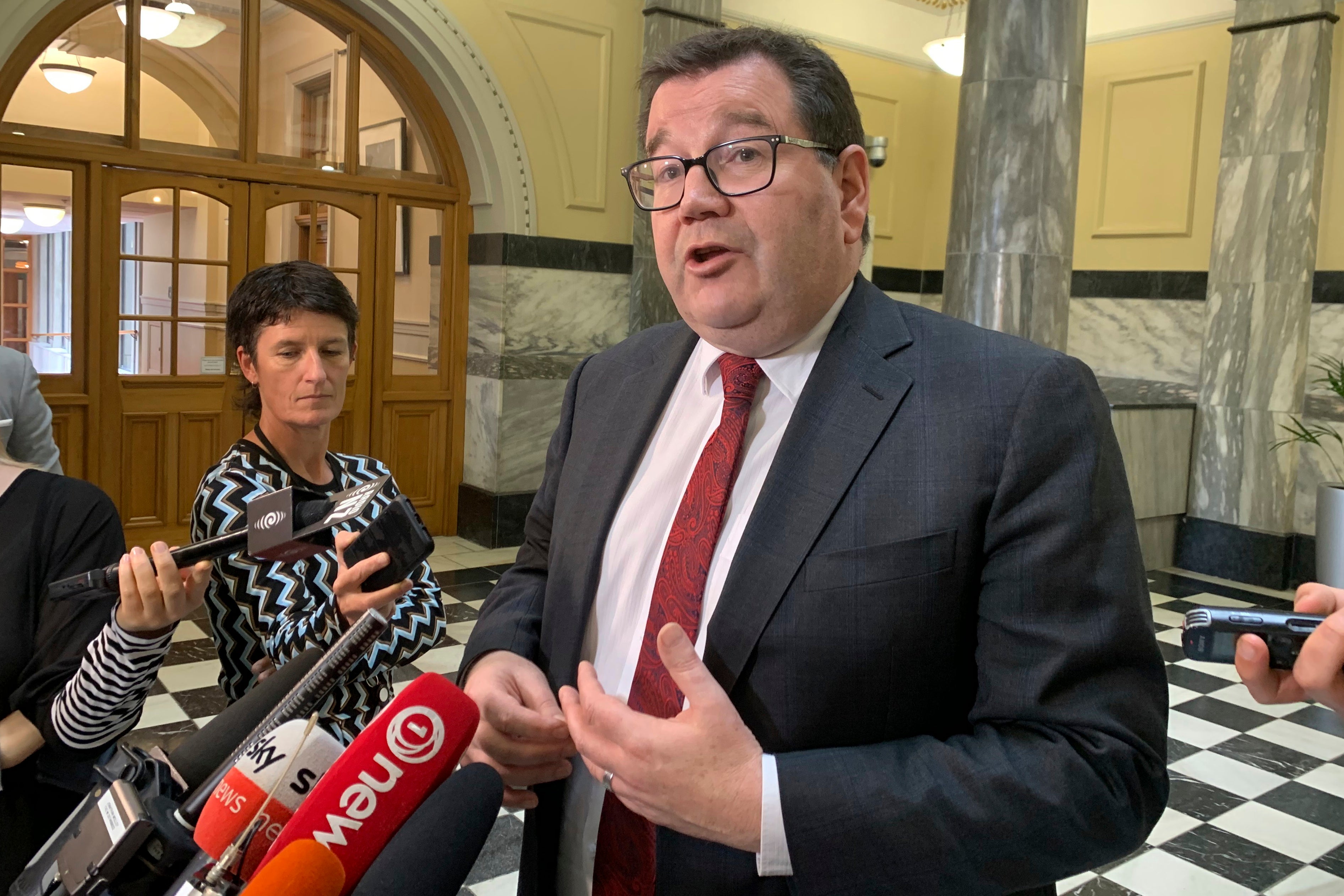 New Zealand’s new deputy prime minister Grant Robertson interacts with the media