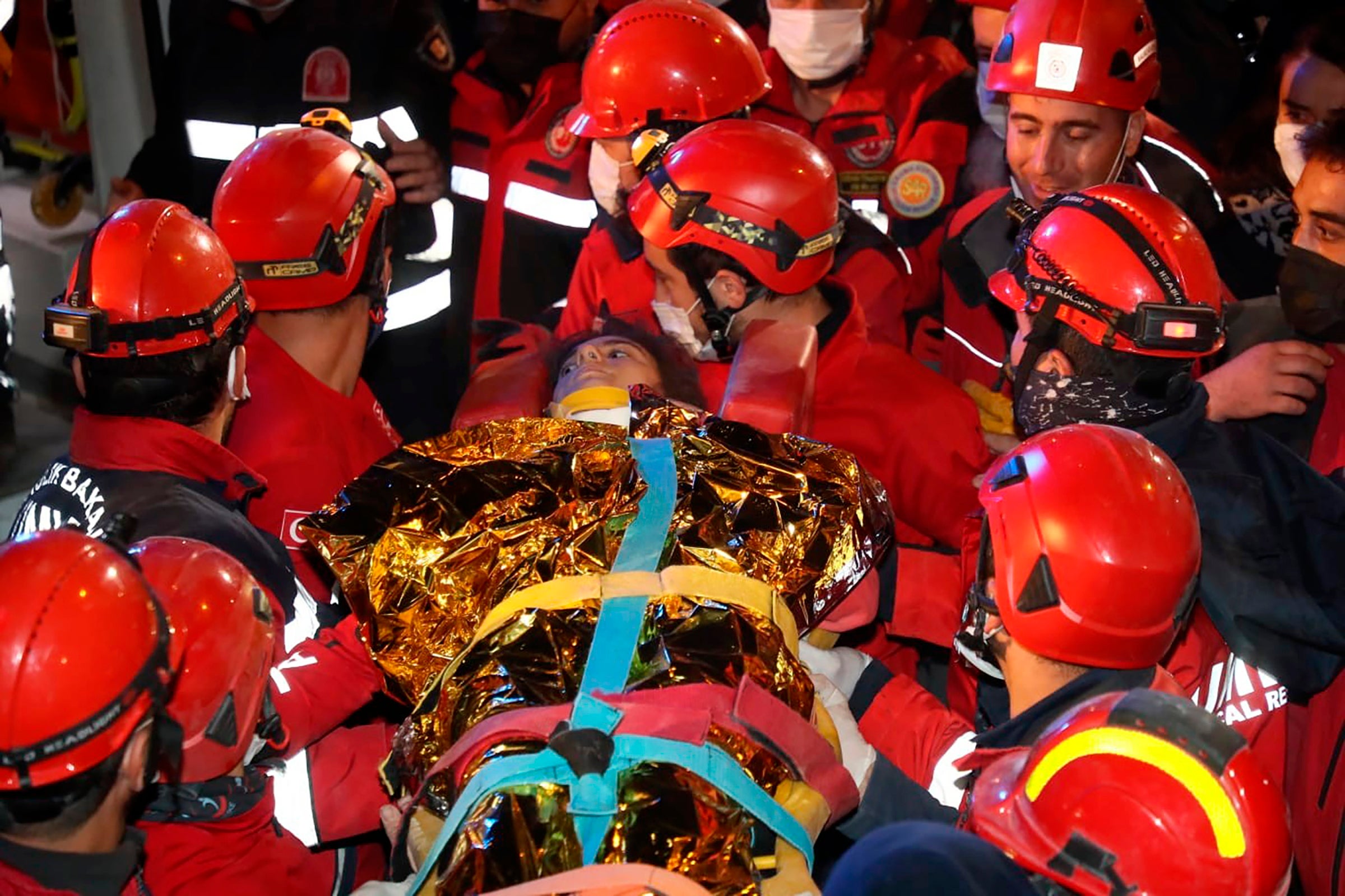 Rescue workers carry Idil Sirin from the rubble