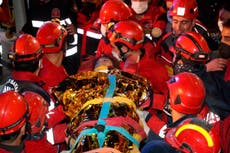 Rescue workers scramble to save more people trapped in Izmir rubble