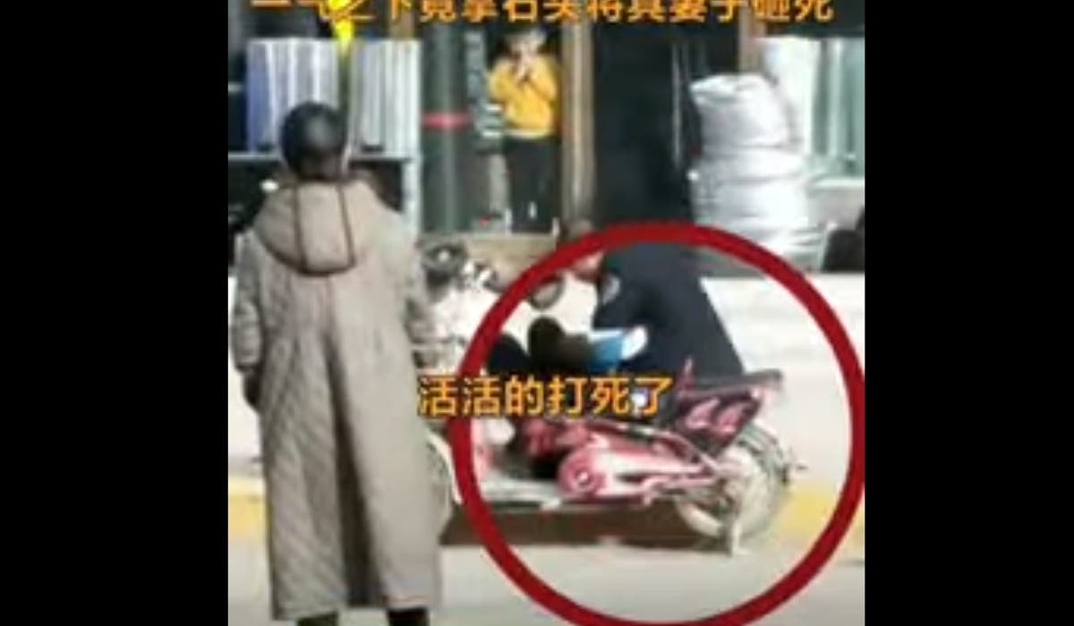 Outrage in China as video shows man beating his wife to death on busy street as members of public look on